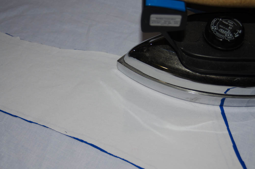 Ironing the glued fabric to dry